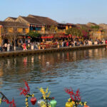 Lantern boat on Hoai River at night with colorful lantern reflections in Hoi An
