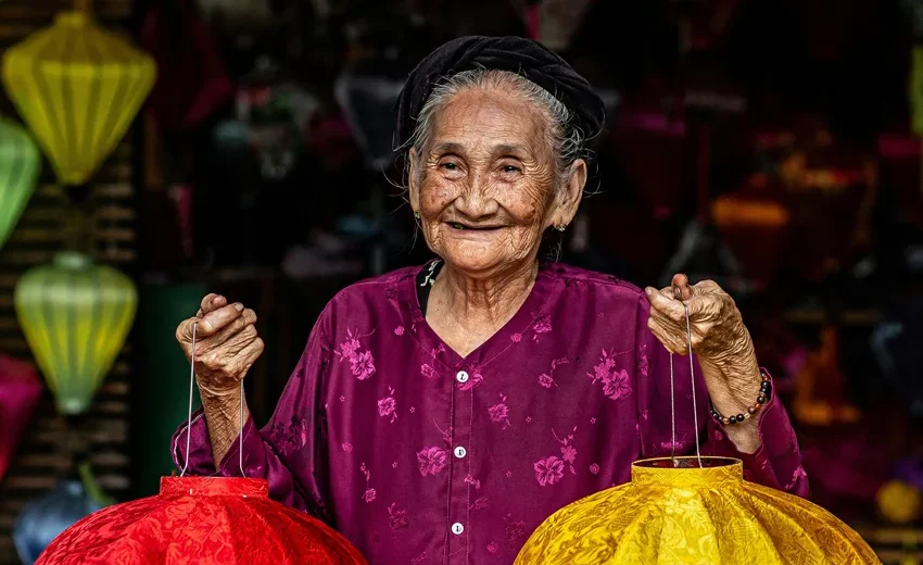 Hoi An lantern making class with tourists creating traditional lanterns
