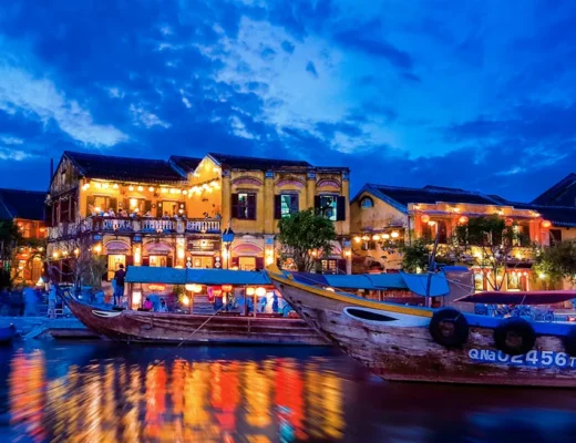 Hoi An at night with colorful lanterns lighting up the ancient town streets