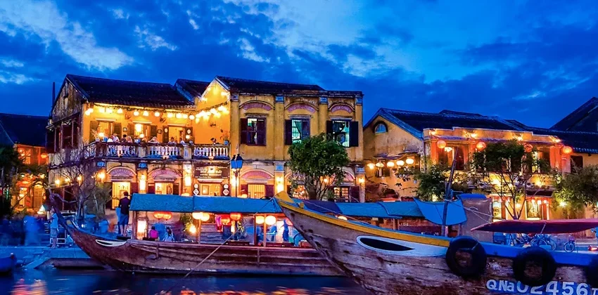 Hoi An at night with colorful lanterns lighting up the ancient town streets