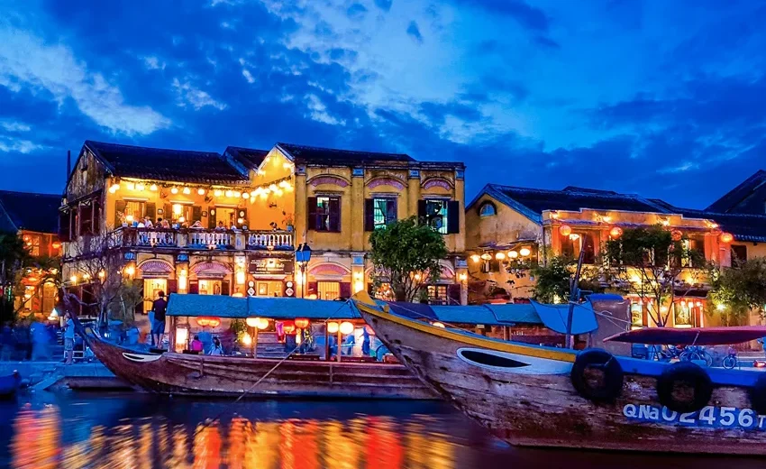 Hoi An at night with colorful lanterns lighting up the ancient town streets