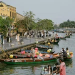 Hoi An lantern boat at night on Thu Bon River with glowing lanterns