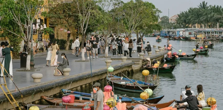 Hoi An lantern boat at night on Thu Bon River with glowing lanterns
